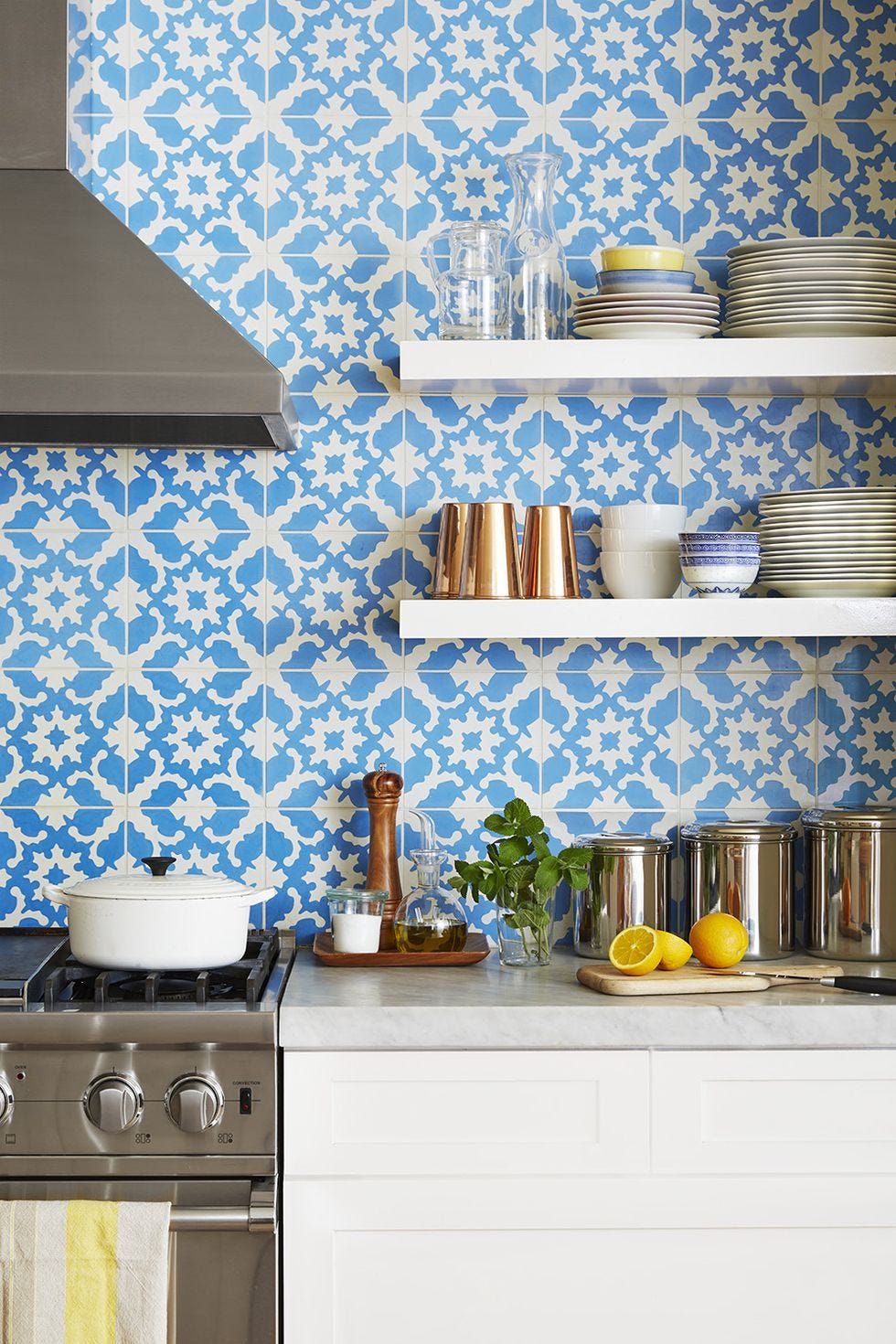 kitchen backsplash ideas, blue and white playful pattern backsplash with wood shelves by the oven