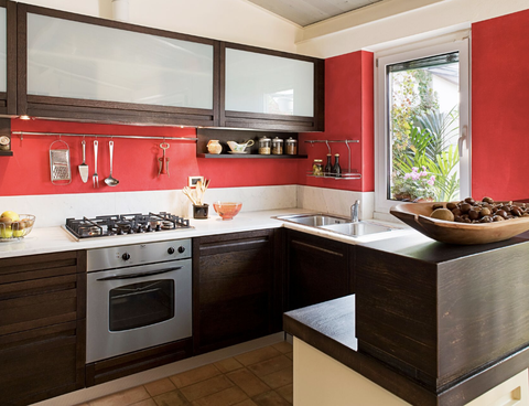 kitchen backsplash ideas, red backsplash in a kitchen with dark wood cabinets