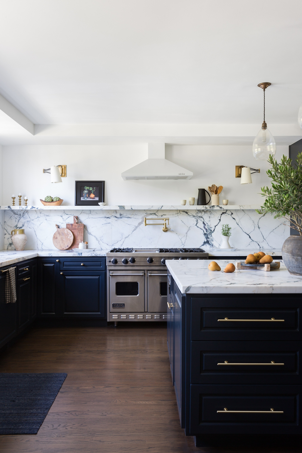 marble backsplash in navy and white kitchen