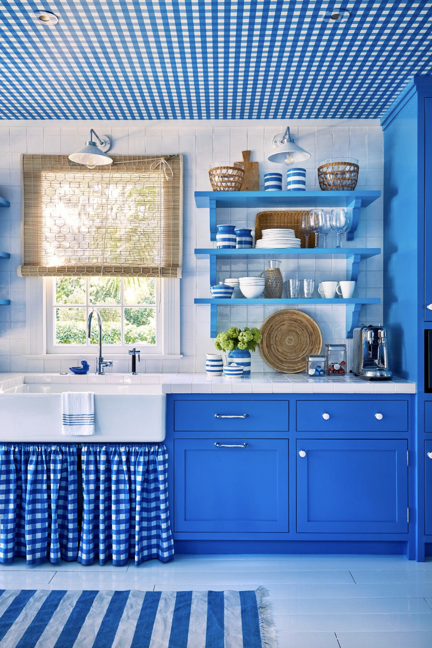 cobalt blue kitchen with gingham sink skirt
