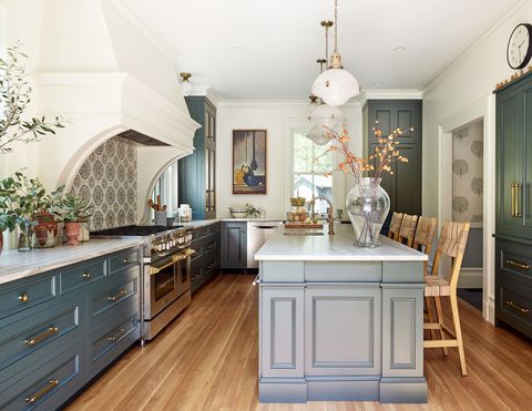 english inspired kitchen with blue green cabinets