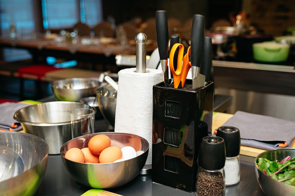kitchen counter with cooking tools and ingredients.