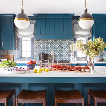 kitchen with blue paint, tiles, and curtains