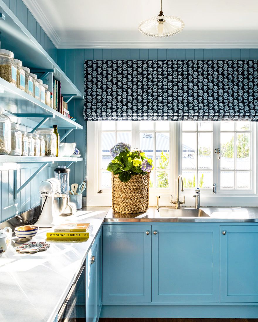 blue kitchen with roman shades