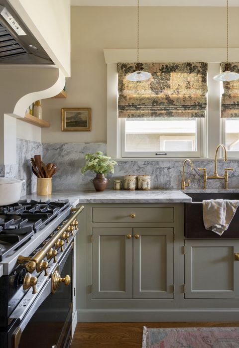 lauren lothrop caron studiolaloc in her own kitchen, the studio laloc founder added warm brass accents and roman shades in darby rose fabric by jasper to make the space more inviting