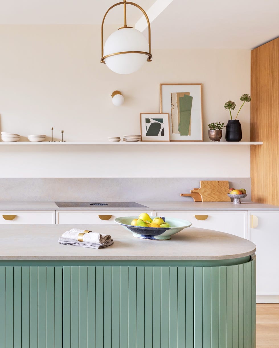 Industrial luxe kitchen island a kitchen with a table and chairs