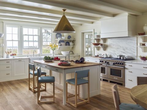 19th century farm in block island, rhode island designed by miles redd and gil schafer kitchen the island countertop is crafted of pippy oak, and the range is by wolf
