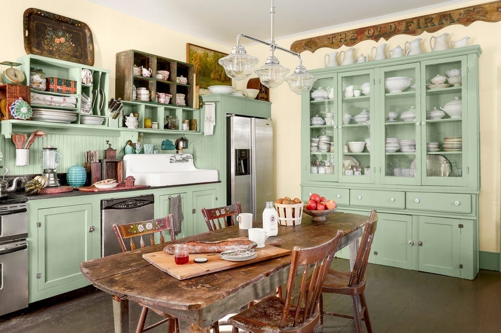 a mint retro farm kitchen with a table and collections