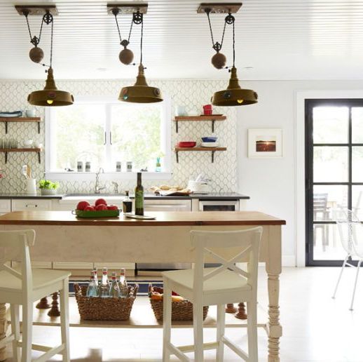 kitchen lights made with industrial pulleys decorate a cook space