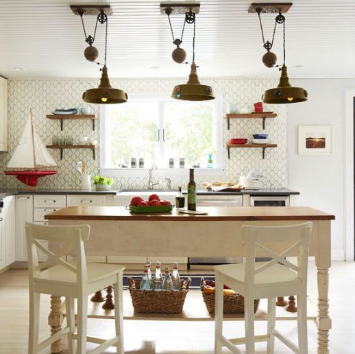 kitchen lights made with industrial pulleys decorate a cook space