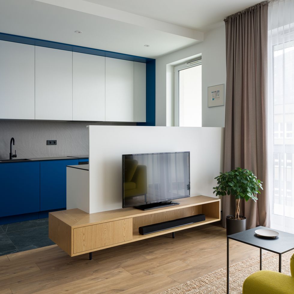 kitchen open to living room with tv