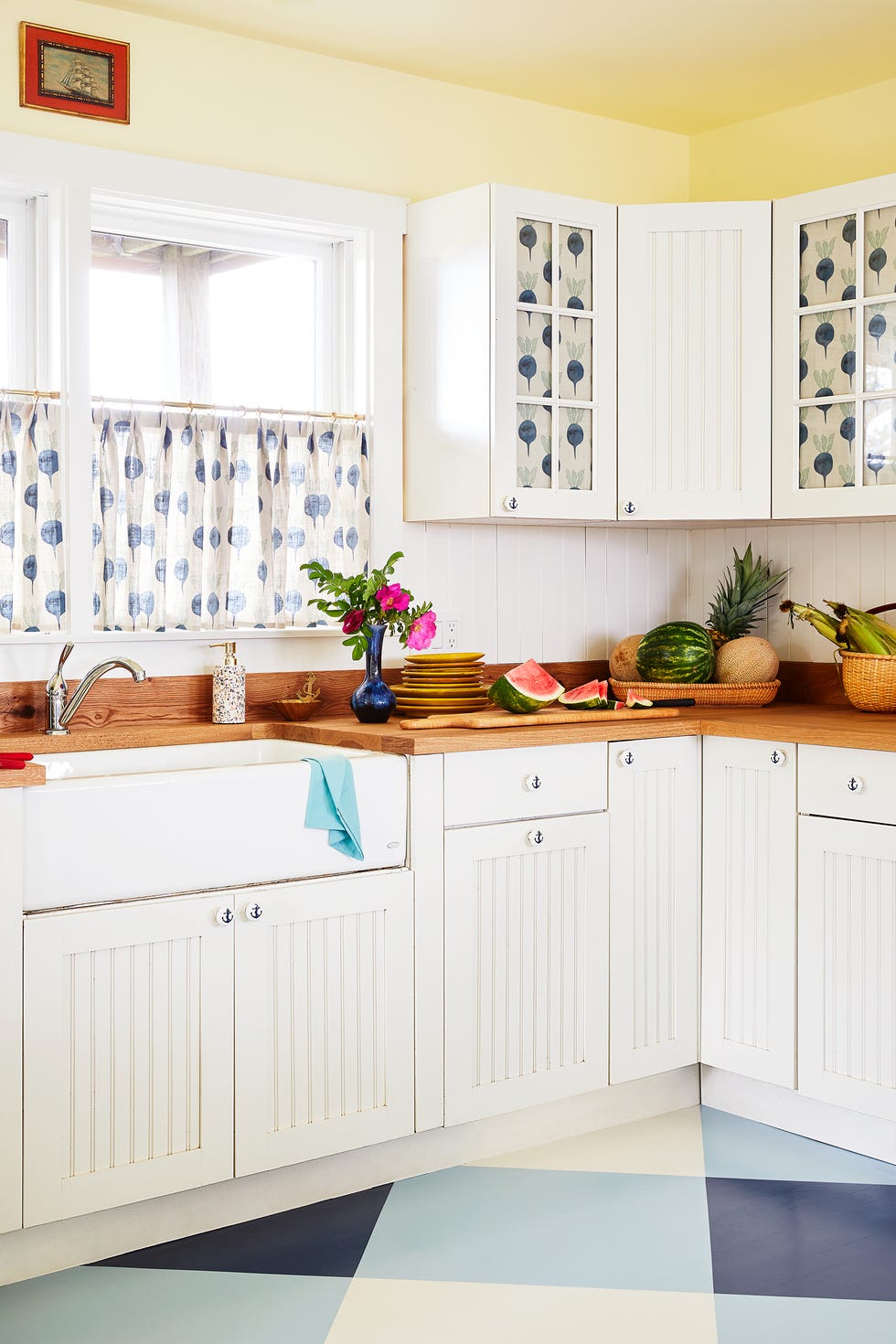 small kitchen with yellow paint