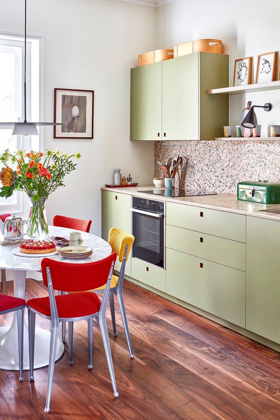 The kitchen of this Victorian flat in South London has been renovated with British-made Foreso worktops and sage green cabinets.