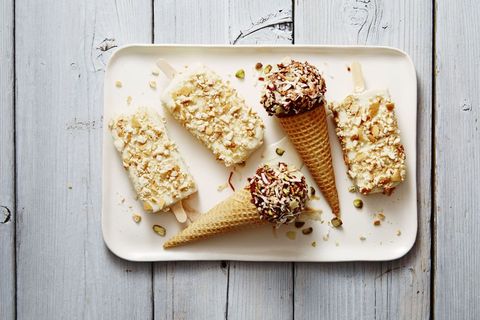 ice cream cones topped with toasted coconut, potato chips, and chopped pistachios
