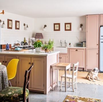 a pastel pink kitchen with quirky retro touches and kitsch vintage accessories