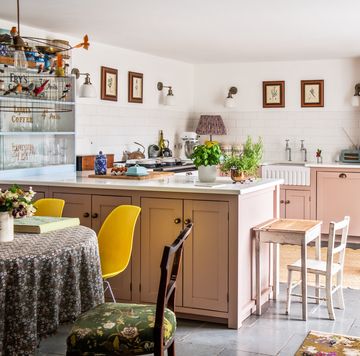 a pastel pink kitchen with quirky retro touches and kitsch vintage accessories