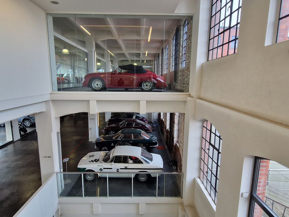 a window with a group of cars parked in it