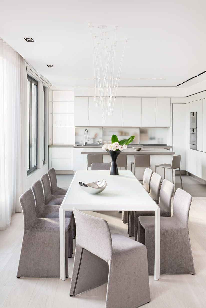 Elegant Contemporary Dining Room with Minimalist Design and Double Height  Ceilings