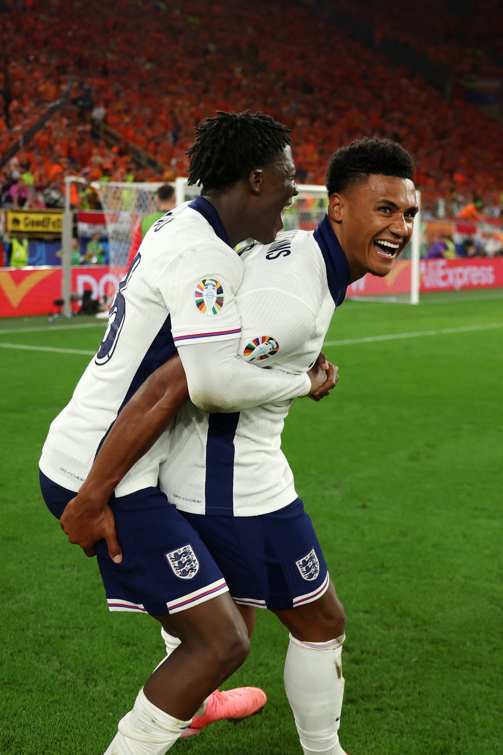 kobbie mainoo hugs ollie watkins, who smiles as they celebrate an england goal