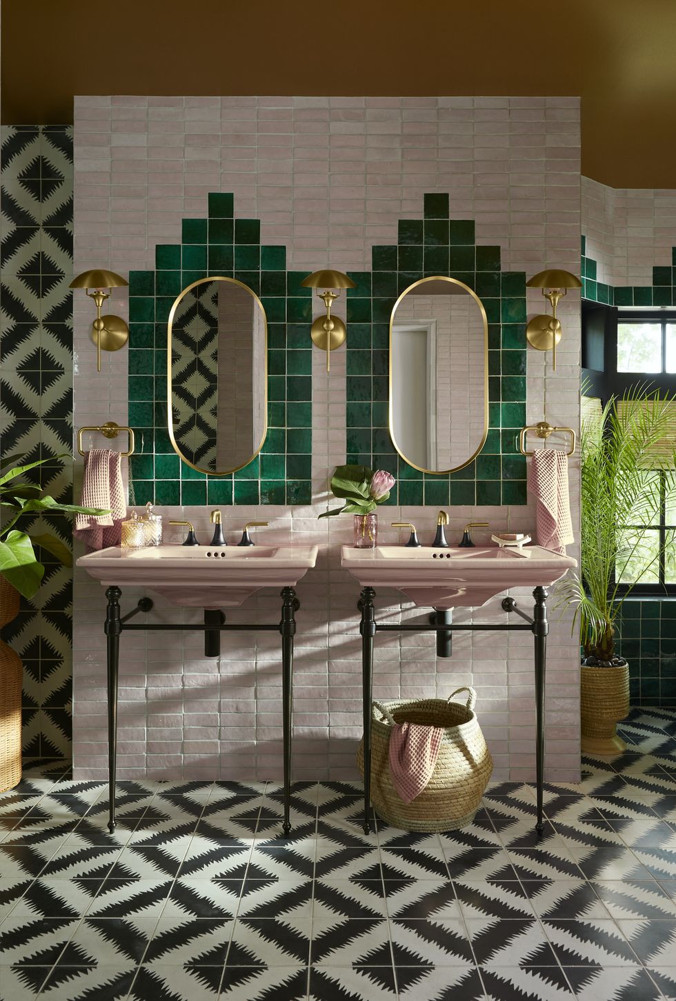 a bathroom with a peach tub sink and mirrors