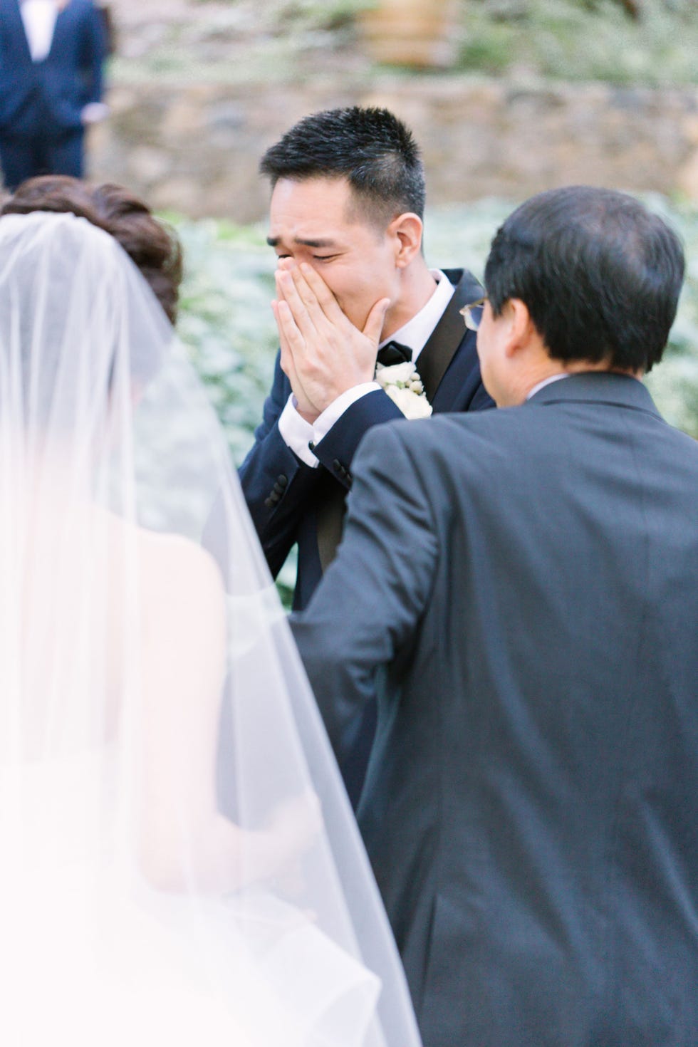 Man hides under brides dress, Man hides under bride's wedding dress to help  her walk amid strong winds - WATCH