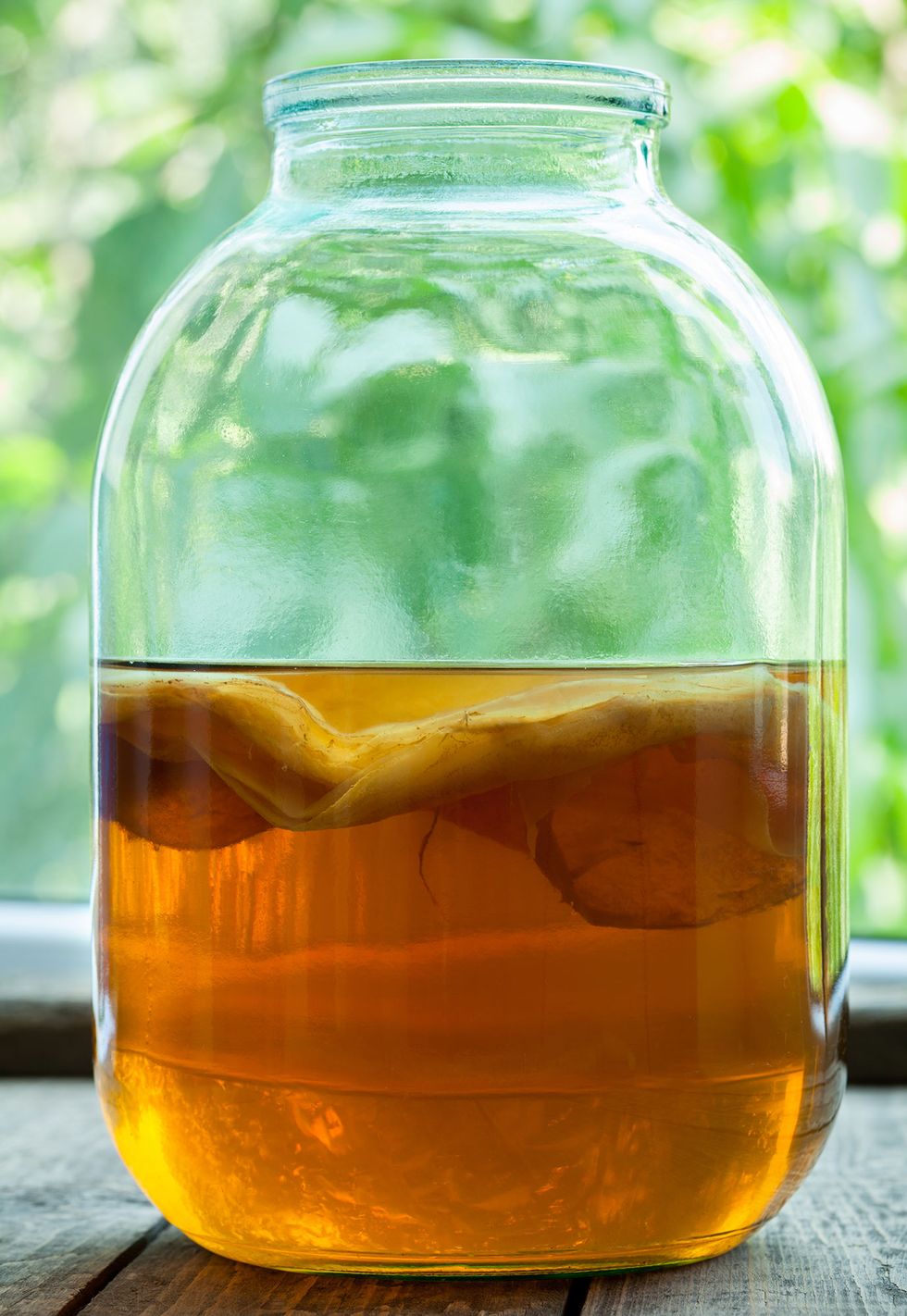 Apple cider vinegar, Mason jar, Drink, Bottle, Glass bottle, Kombucha, Honey, Caramel color, Mead, Vegetable oil, 