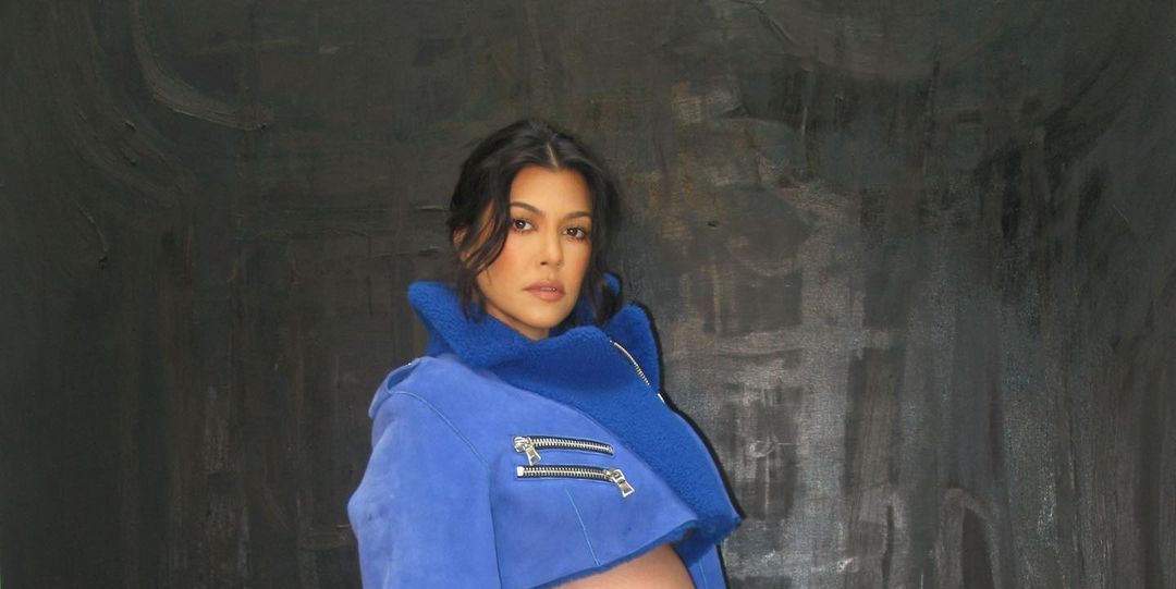 Kourtney Kardashian bares baby bump in fishnet and denim grunge fit