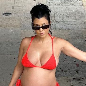 Kourtney Kardashian Shows Off Her Pregnancy in Tiny Red String Bikini