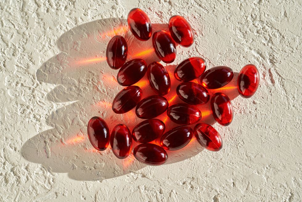 krill oil pills on a white background in sunlight