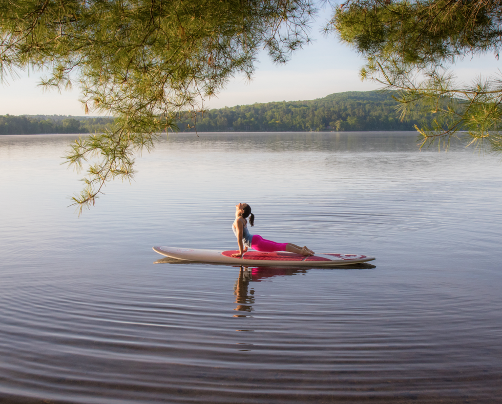 Person paddleboarding on a lake