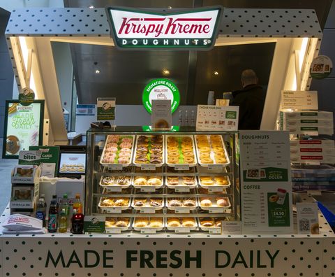 krispy kreme doughnuts stall in buttermarket shopping center, ipswich, suffolk, england, uk