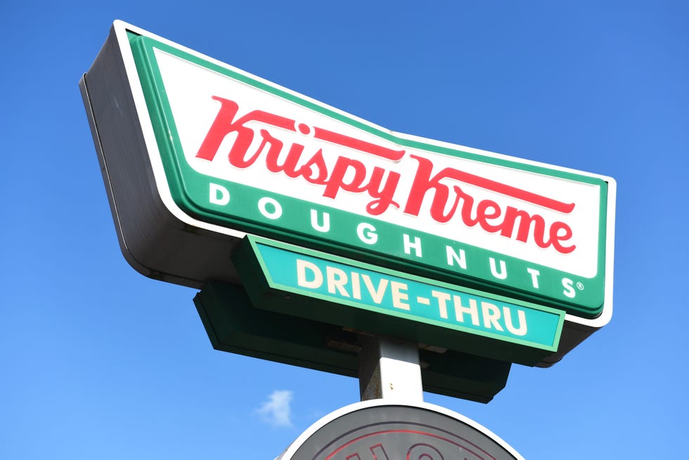 krispy kreme doughnuts store sign on building exterior, store frontage