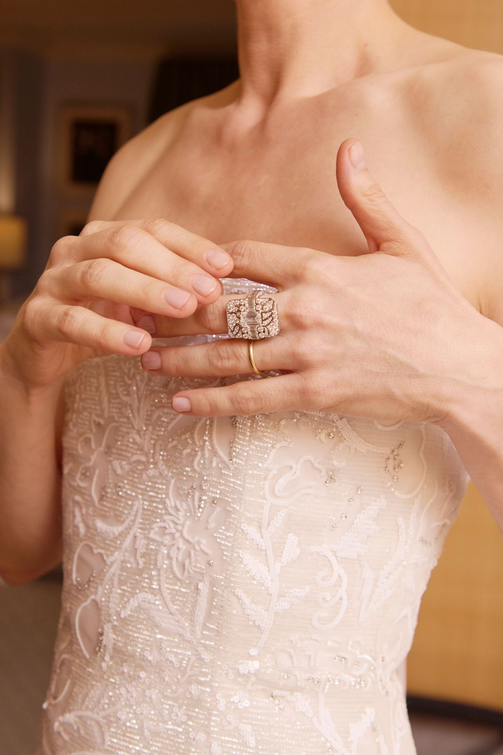 a person holding a wedding ring