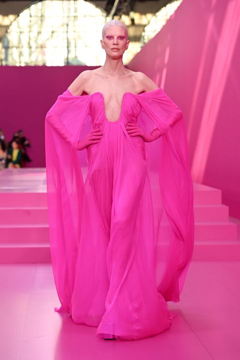 woman in pink dress on pink runway