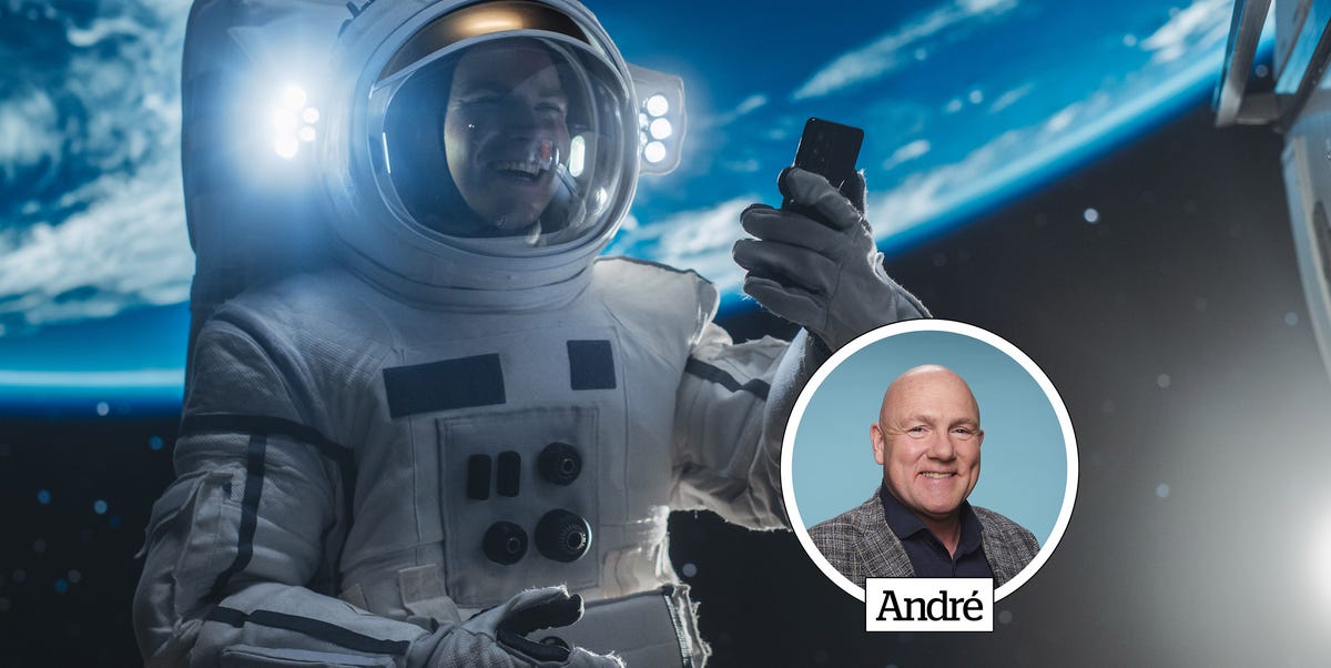 an astronaut in space holding a phone with earth in the background an astronaut in space holding a phone with earth in the background