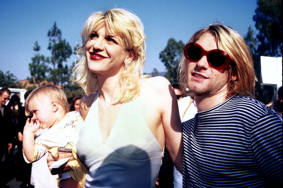 kurt cobain, courtney love and baby frances bean attending the 1993 mtv music video awards in los angeles 090293
