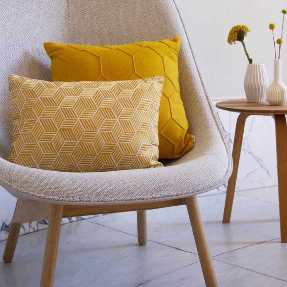 Furniture, Yellow, Chair, Throw pillow, Cushion, Room, Interior design, Pillow, Slipcover, Table, 