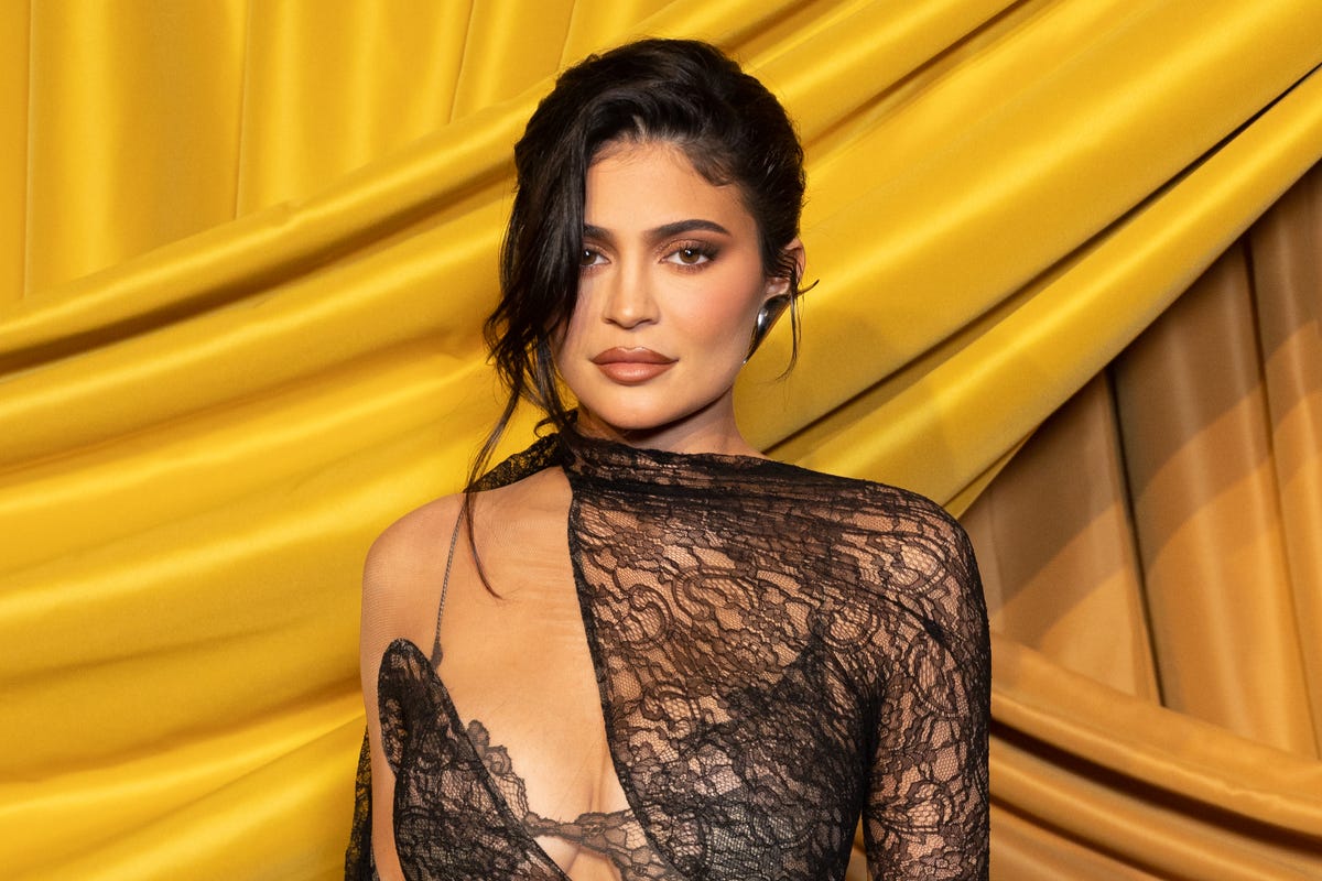 Kylie Jenner Goes To Work In A Sheer Plunging Crop Top And Skirt 