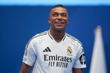 kylian mbappe smiles as he attends his real madrid signing announcement