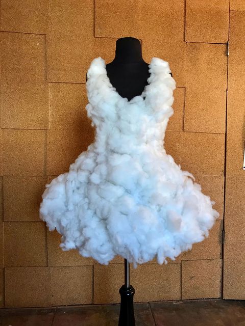 Clothing, White, Dress, Fur, Cocktail dress, Outerwear, Ruffle, Textile, Bridal party dress, Gown, 