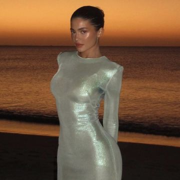 a person in a dress on a beach