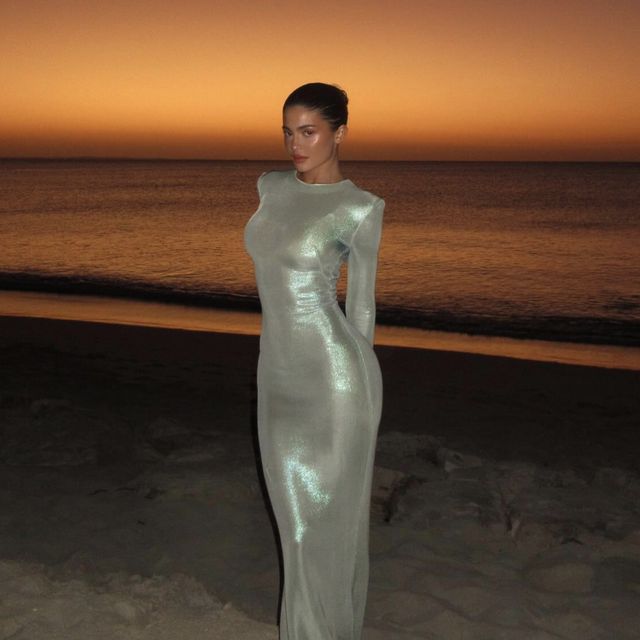 a person in a dress on a beach