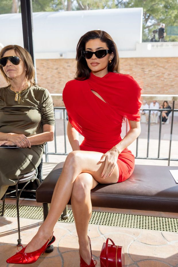 kylie jenner sitting front row at the jacquemus' fashion show wearing head to toe red