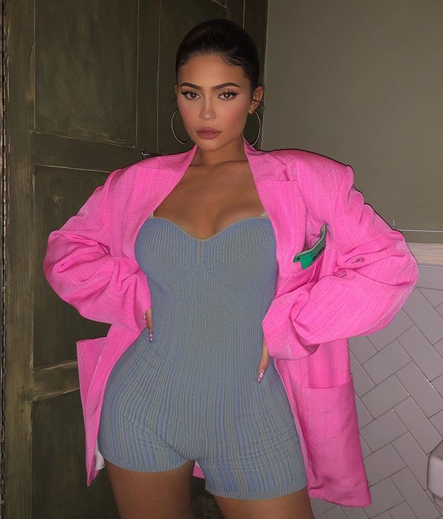 Kylie Jenner looks unrecognizable with new eyebrows as she nearly topples  out of plunging mini dress in new NSFW photo
