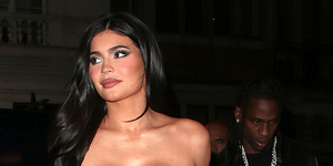 Kylie Jenner spills out of ripped denim dress as she poses in $2.5