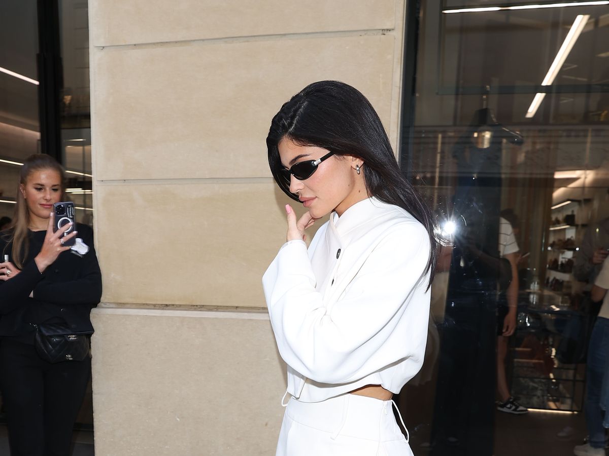 Kylie Jenner puts on a classy display in a white miniskirt and matching  blazer at Chanel in Paris