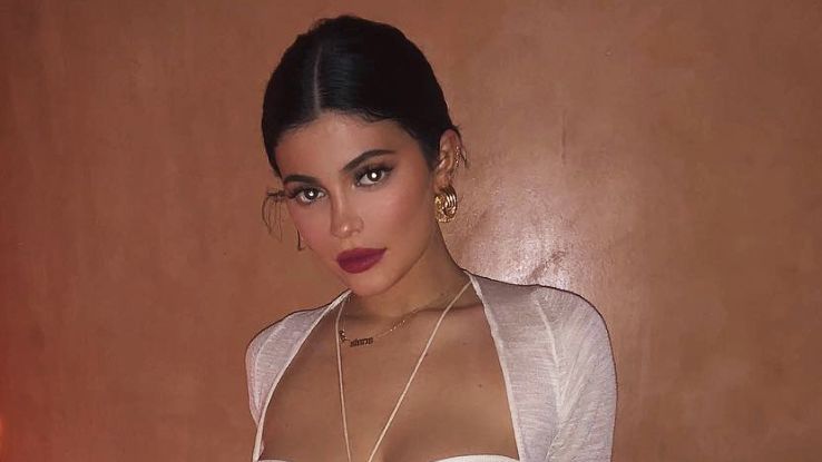 Kylie Jenner's white tights, naked dress, and double handbag look is such a  rich text