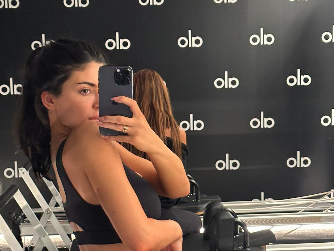 Kylie Jenner wears Alo Yoga sports bra and leggings