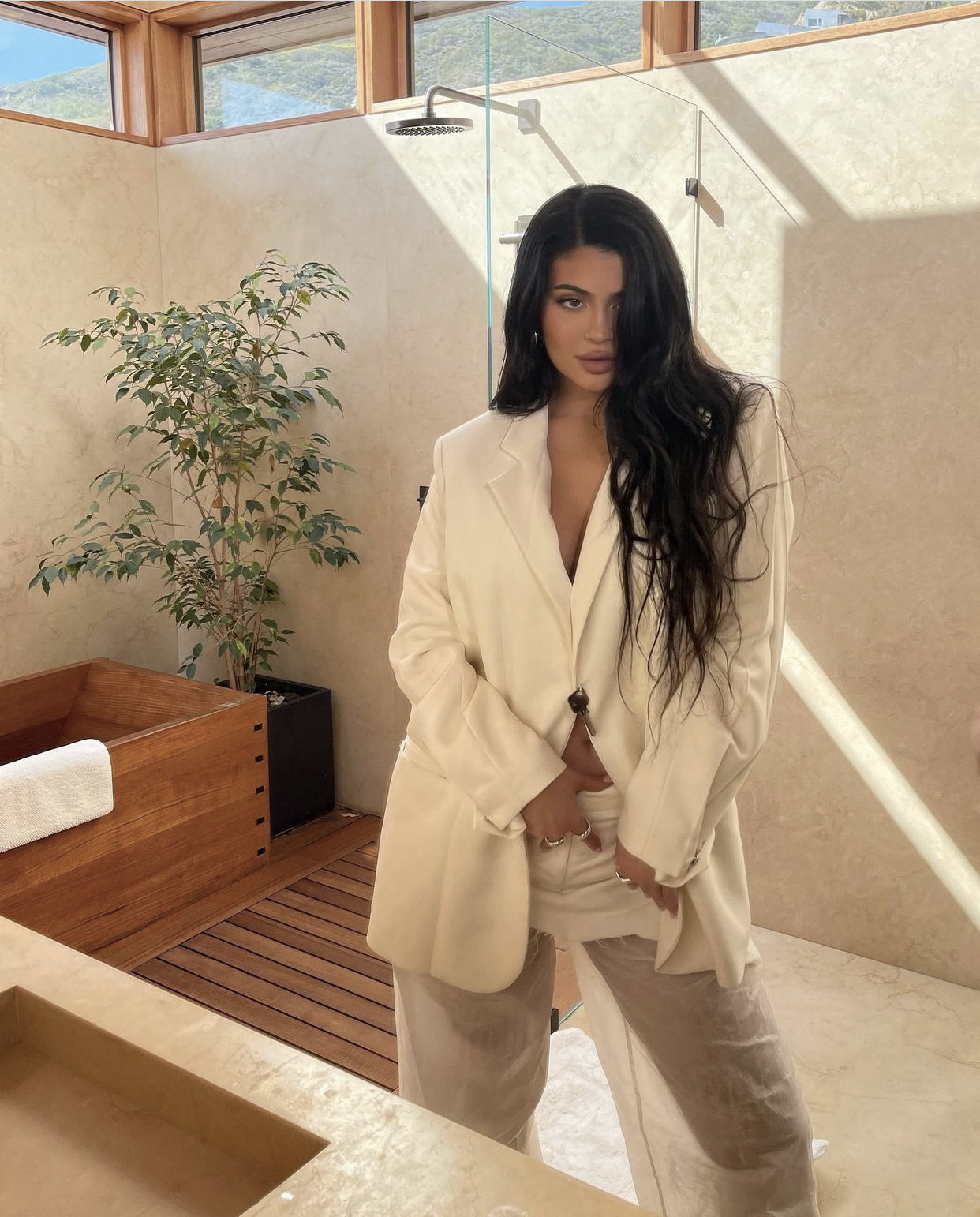 Kylie Jenner Makes Skirt Suit Sexy With White Blazer and Mini Skirt