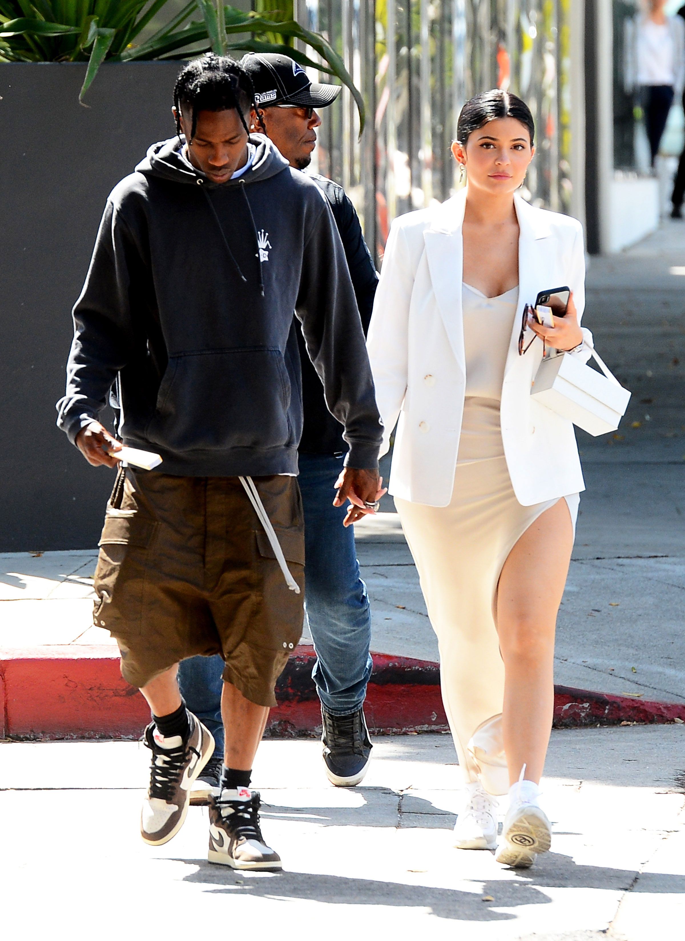Kylie Jenner shows legs in mini dress with Travis Scott